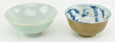 Lot 63 - TWO QING DYNASTY CERAMIC BOWLS 清 紫金釉酱釉青花碗和青釉碗