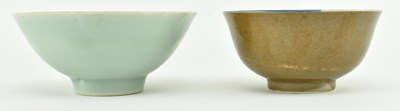 Lot 63 - TWO QING DYNASTY CERAMIC BOWLS 清 紫金釉酱釉青花碗和青釉碗