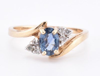 Lot 206 - HALLMARKED 9CT GOLD SAPPHIRE & DIAMOND CROSSOVER RING