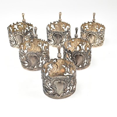 Lot 196 - VICTORIAN HALLMARKED SILVER SET OF SIX ROCOCO CUP HOLDERS