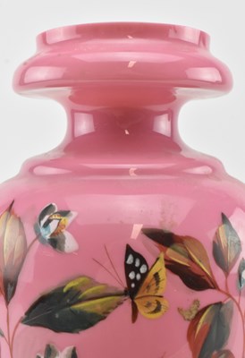 Lot 120 - TWO VICTORIAN OPALINE GLASS VASES IN PINK WITH HAND PAINTED FLORAL DESIGN