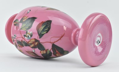 Lot 120 - TWO VICTORIAN OPALINE GLASS VASES IN PINK WITH HAND PAINTED FLORAL DESIGN