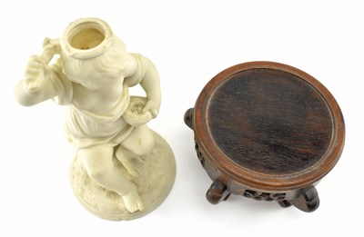 Lot 140 - 19TH CENTURY BISQUE FIGURINE CANDLE HOLDER RAISED ON WOODEN SOCLE BASE