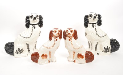 Lot 30 - TWO PAIRS OF CERAMIC STAFFORDSHIRE SPANIEL DOGS