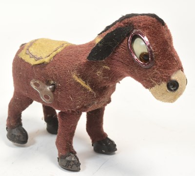 Lot 317 - VINTAGE 1950S WIND-UP FELT DONKEY TOY MADE IN JAPAN