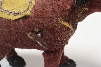 Lot 317 - VINTAGE 1950S WIND-UP FELT DONKEY TOY MADE IN JAPAN