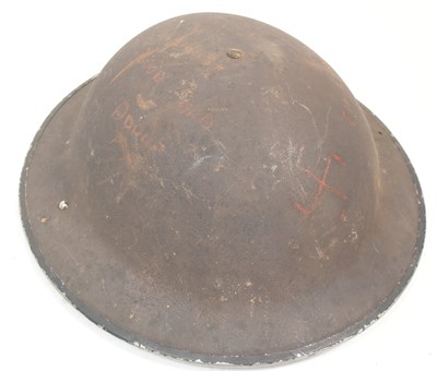 Lot 354 - WWII SECOND WORLD WAR BRODIE HELMET WITH GERMAN GRAFFITI