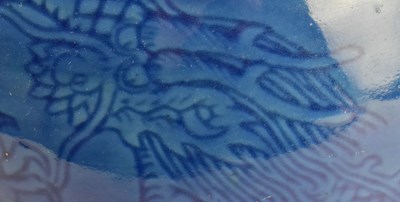 Lot 154 - QING / REPUBLIC MONCHROME BLUE GLAZED CERAMIC VASE 清 民国 刻龙纹蒜头瓶