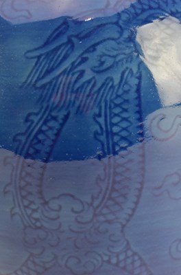 Lot 154 - QING / REPUBLIC MONCHROME BLUE GLAZED CERAMIC VASE 清 民国 刻龙纹蒜头瓶