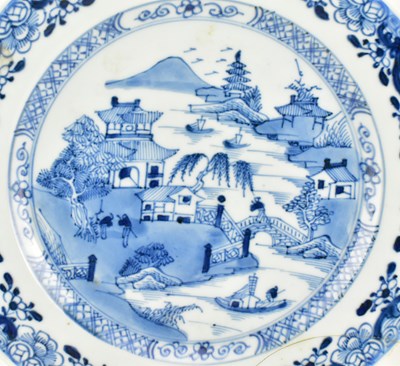 Lot 117 - PAIR OF QING DYNASTY BLUE AND WHITE CHARGERS 清 青花山水八角盘一对