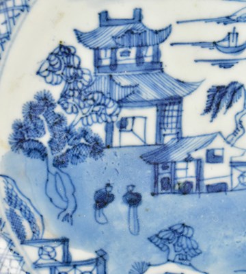 Lot 117 - PAIR OF QING DYNASTY BLUE AND WHITE CHARGERS 清 青花山水八角盘一对