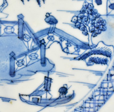 Lot 117 - PAIR OF QING DYNASTY BLUE AND WHITE CHARGERS 清 青花山水八角盘一对