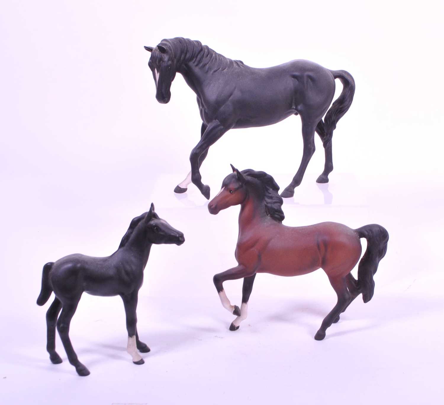 Lot 35 - BESWICK - THREE MID CENTURY BISQUE PORCELAIN HORSE FIGURES