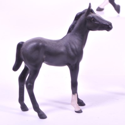 Lot 35 - BESWICK - THREE MID CENTURY BISQUE PORCELAIN HORSE FIGURES