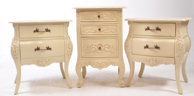 Lot 697 - CHICHI - PAIR OF CARVED BOMBE PAINTED BEDSIDE CHEST OF DRAWERS