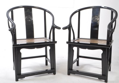 Lot 717 - PAIR OF CHINESE BLACK LACQUERED HORSESHOE ARMCHAIRS
