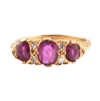Lot 42 - 18CT GOLD RUBY & DIAMOND THREE STONE RING
