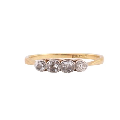 Lot 68 - EDWARDIAN 18CT GOLD & PLATINUM FOUR STONE DIAMOND RING