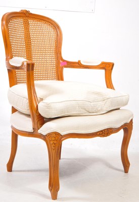 Lot 1033 - A 20TH CENTURY WALNUT LOUIS STYLE BERGERE CHAIR