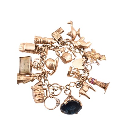 Lot 65 - HALLMARKED 9CT GOLD CHARM BRACELET WITH HEART PADLOCK CLASP