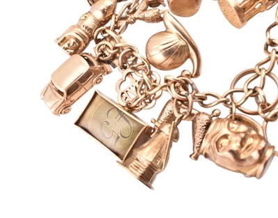 Lot 65 - HALLMARKED 9CT GOLD CHARM BRACELET WITH HEART PADLOCK CLASP