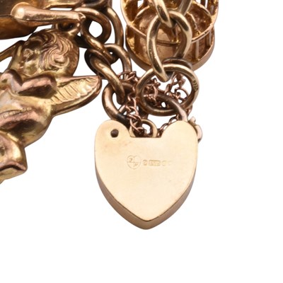 Lot 65 - HALLMARKED 9CT GOLD CHARM BRACELET WITH HEART PADLOCK CLASP