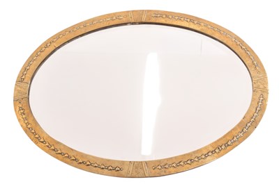 Lot 612 - ARTS & CRAFTS EARLY 20TH CENTURY EMBOSSED BRASS OVAL WALL MIRROR