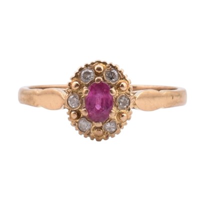 Lot 46 - HALLMARKED 9CT GOLD RUBY & DIAMOND HALO RING