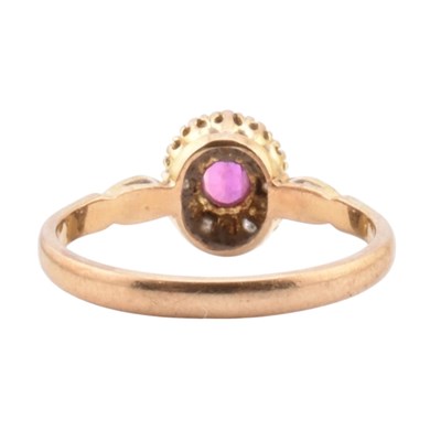 Lot 46 - HALLMARKED 9CT GOLD RUBY & DIAMOND HALO RING