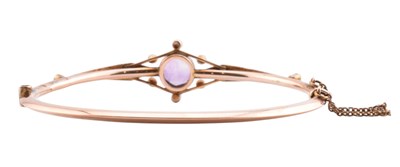 Lot 3 - EDWARDIAN 9CT GOLD AMETHYST & PEARL HINGED BANGLE