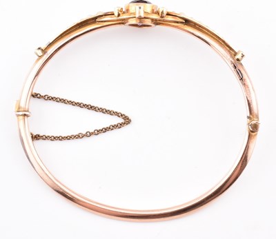 Lot 3 - EDWARDIAN 9CT GOLD AMETHYST & PEARL HINGED BANGLE