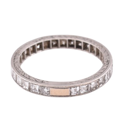 Lot 109 - PLATINUM GOLD & DIAMOND ETERNITY RING