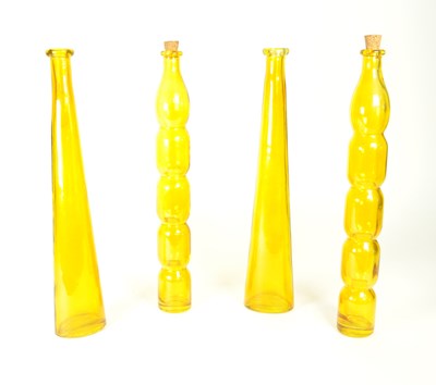 Lot 19 - FOUR MID 20TH CENTURY AMBER GLASS BOTTLES