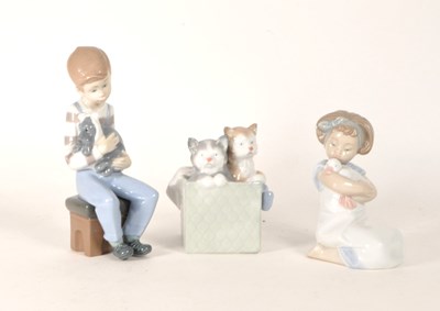 Lot 21 - NAO BY LLADRO - THREE VINTAGE 20TH CENTURY PORCELAIN FIGURINES