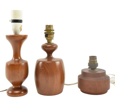 Lot 166 - THREE MID CENTURY SOLID TEAK TABLE LAMPS