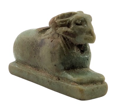 Lot 56 - 18TH DYNASTY GREEN AMULETIC PENDANT OF A CRIOSPHINX