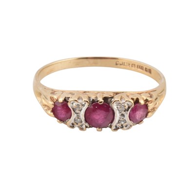 Lot 439 - HALLMARKED 9CT GOLD RUBY AND DIAMOND THREE STONE RING