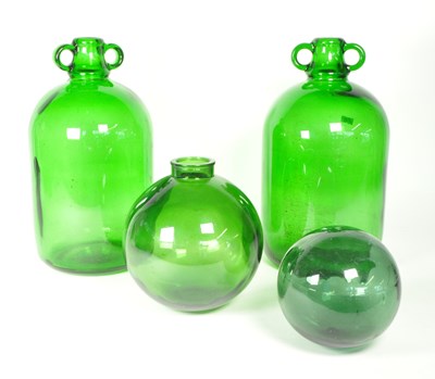 Lot 33 - TWO VINTAGE GREEN GLASS DEMIJOHN BOTTLES