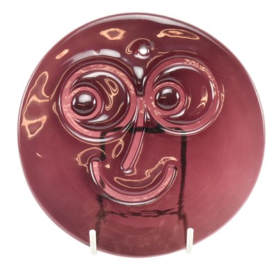 Lot 230 - ALFRED FISHER FOR WHITEFRIARS - GLASS SMILEY SUN CATCHER IN AUBERGINE