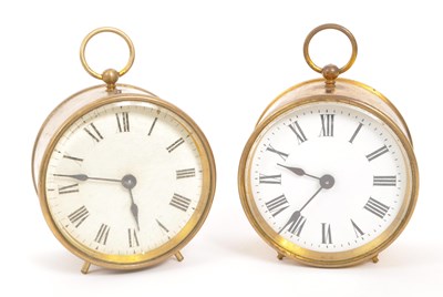 Lot 378 - TWO EARLY 20TH CENTURY BRASS CASED ALARM CLOCKS