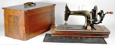 Lot 298 - WEAVER & SON - EARLY 20TH CENTURY WALNUT CASED SEWING MACHINE