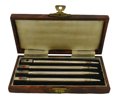 Lot 34 - CASED STERLING SILVER SET OF CARD GAME SUITS PROPELLING PENCILS