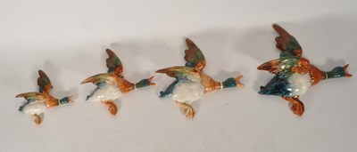 Lot 175 - BESWICK - FOUR MID CENTURY CERAMIC GRADUATING DUCK WALL PLAQUES
