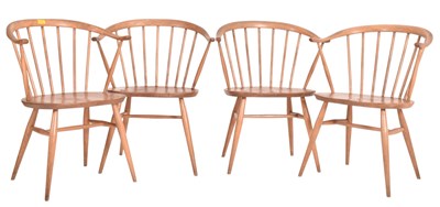 Lot 13 - ERCOL - FOUR VINTAGE BEECH AND ELM COWHORN CARVER ARMCHAIRS