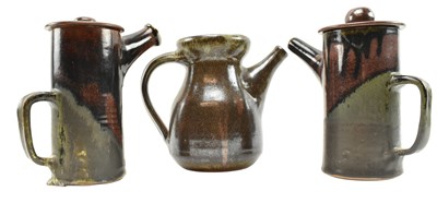 Lot 25 - THREE RAKU GLAZED LIDDED TEAPOTS, ONE THE FRIARY AYLESFORD