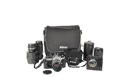 Lot 211 - NIKON - VINTAGE FM2 SLR CAMERA & EQUIPMENT