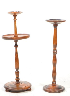 Lot 1045 - TWO EARLY 20TH CENTURY TURNED MAHOGANY FLOOR STANDING ASHTRAYS