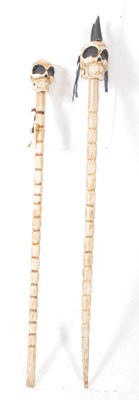 Lot 1038 - TWO VINTAGE 20TH CENTURY NOVELTY SKULL POLES
