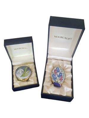 Lot 83 - MOORCROFT - TWO LATE 20TH / 21ST CENTURY ENAMEL LIDDED TRINKET POTS