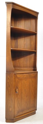 Lot 802 - ERCOL FURNITURE - 20TH CENTURY BEECH & ELM WOOD CORNER CUPBOARD